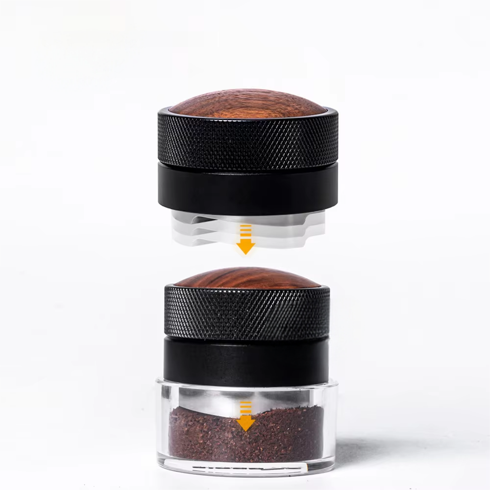 Spring-loaded self-leveling coffee tamper showing downward travel into a coffee bed